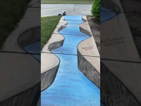 3D Chalk Art  a river running through a canyon